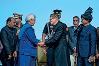 Omar Abdullah greets Lt Governor Manoj Sinha (left) after taking his oath as chief minister of Jammu & Kashmir