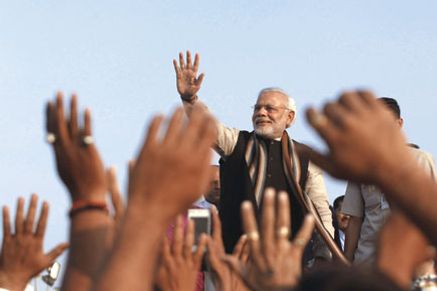 Narendra Modi greets supporters in Ahmedabad, 2013