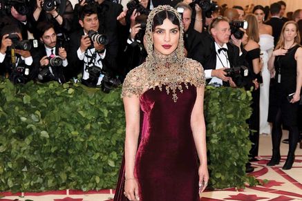 Priyanka Chopra in a maroon and gold Ralph Lauren gown