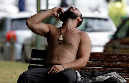 A man reacts as he speaks on a mobile phone after a mass shooting in a mosque in which many people were killed in Christchurch, New Zealand, on March 15, 2019  (Photo: AP)