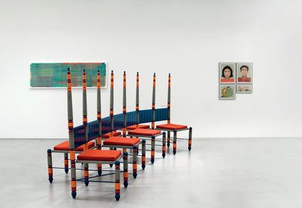 Modular interlinked chair by tony Joseph, with works of Harisha Chennangod (left) and Shailesh BR (right) in the background