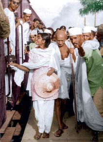 Mahatma Gandhi on a railway platform with Manu Gandhi, Delhi, 1947