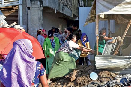 Protesters take down a security bunker outside the residence of a legislator (