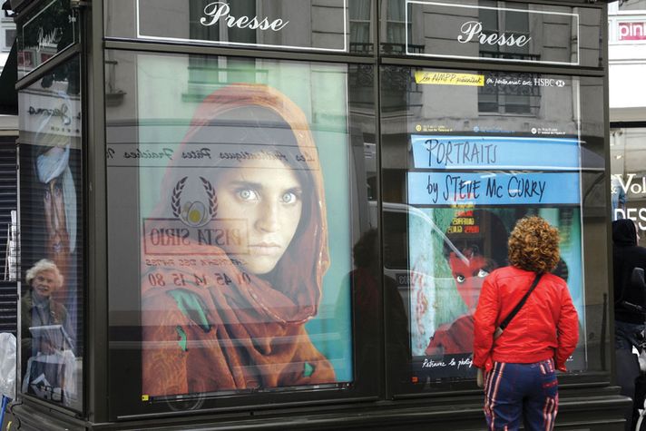 Works by McCurry displayed at a news kiosk in Paris