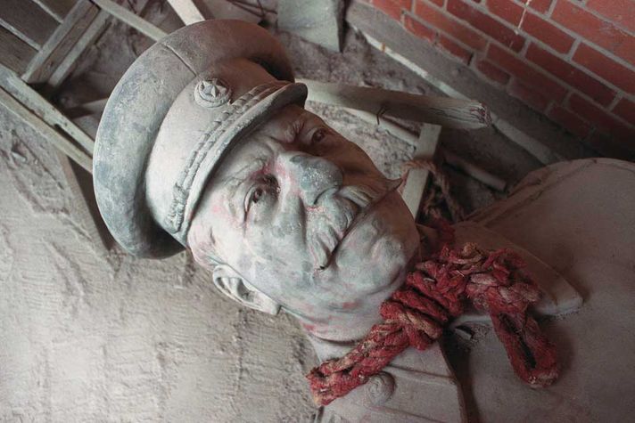 A statue of Stalin lies knocked over in Fallen Monument Park, Moscow, after the 1991 coup 