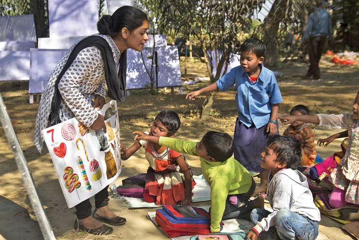 Pada Murmu teaches Santal children in Ghosaldanga