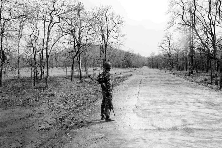 A CRPF jawan guards a road in the Maoist affected Gadchiroli district in Maharashtra 