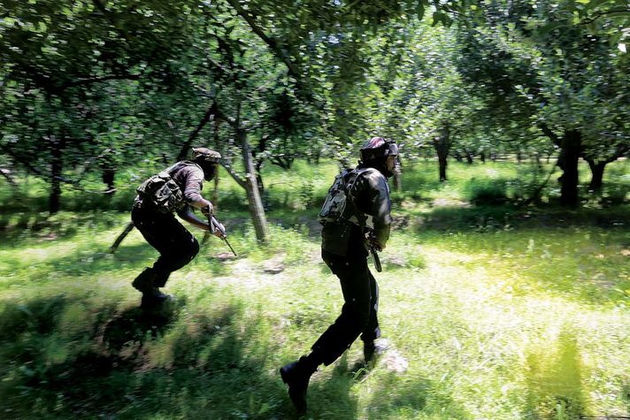 SOG personnel on a ‘search and destroy’ operation in an orchard in Kulgam