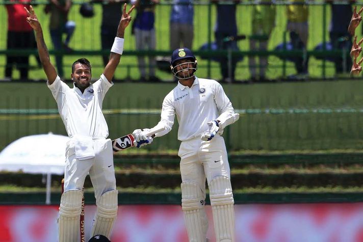 Hardik Pandya (left) celebrates his century at Kandy on August 13