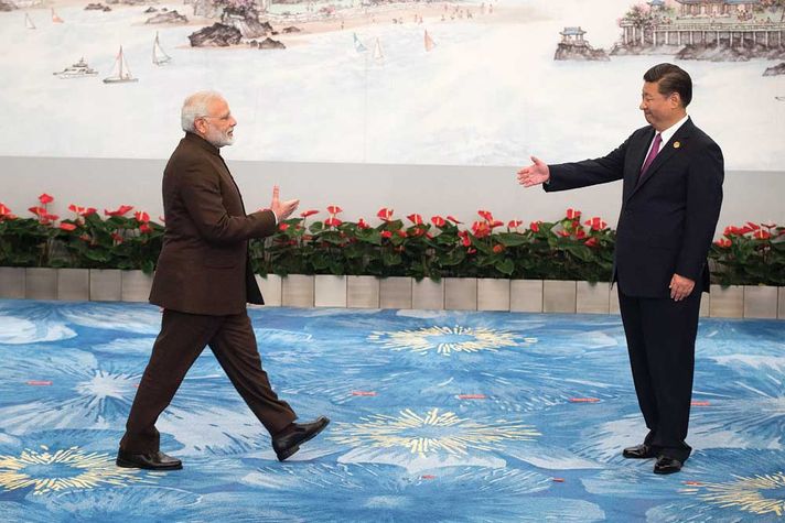 Chinese President Xi Jinping welcomes Prime Minister Narendra Modi at a BRICS banquet in Xiamen on September 4