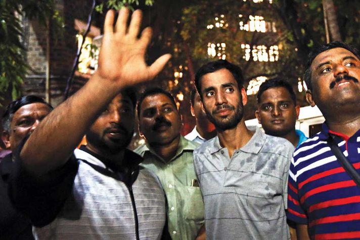 Crime branch inspector Sanjay Nikam (with hand raised) and accused Sajjad Ahmed Mughal (in a grey T-shirt) in Mumbai on October 10, 2017