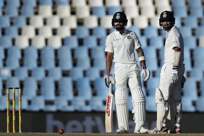 Virat Kohli (left) and Cheteshwar Pujara 