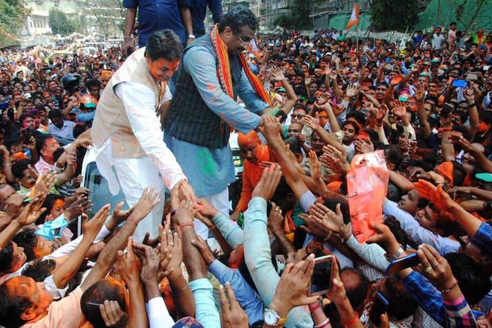 BJP National General Secretary Ram Madhav and Tripura BJP chief Biplab Kumar Deb greet the supporters after party's victory in Tripura Assembly elections