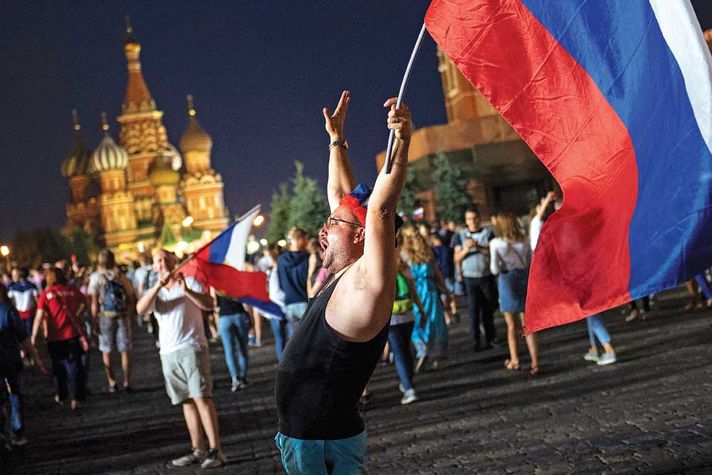 Muscovites celebrate late into the night around the Kremlin after their team’s win