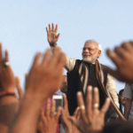 Narendra Modi greets supporters in Ahmedabad, 2013