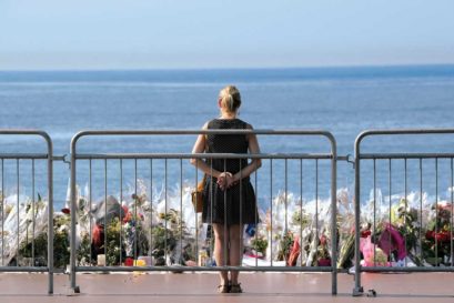 A woman at a makeshift memorial after the Nice attack