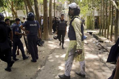 Police outside the blast site in Kishoreganj, Bangladesh, which took place on Eid, 7 July