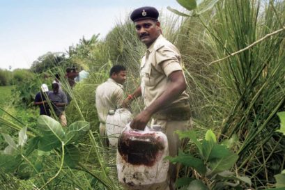 Policemen recover illicit liquor from a field near Gopalganj