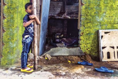 An injured woman awaits medical attention in her house at a regular Sri Lankan Tamil refugee camp in Gummidipoondi, Tamil Nadu