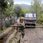 A soldier at a military checkpoint near LoC