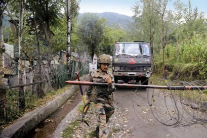 A soldier at a military checkpoint near LoC