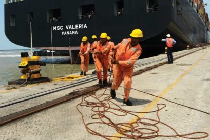 Cargo is loaded onto a Swiss containership at Mundra port, Gujarat