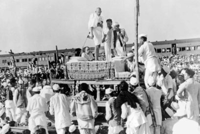 Gandhi addresses a crowd at a railway platform in Assam, 1946