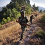 Soldiers patrol near the Line of Control at Krishna Ghati