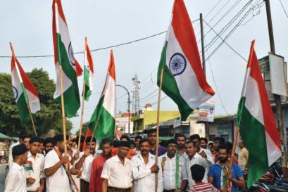 Ghanshyamdas Gupta (centre, with flag), head of the VHP in Bisauli, leads a procession calling for Babloo’s arrest