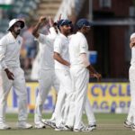 Virat Kohli (R) hugs his teammate Mohammed Shami after winning the fourth day of the third Test match between South Africa and India at Wanderers cricket ground in Johannesburg on January 27, 2018