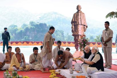 Narendra Modi and LK Advani at an inaugural ritual on the site in Gujarat of the proposed Statue of Unity with a replica of it in the background, October 2013