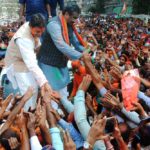 BJP National General Secretary Ram Madhav and Tripura BJP chief Biplab Kumar Deb greet the supporters after party's victory in Tripura Assembly elections