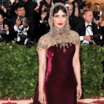 Priyanka Chopra in a maroon and gold Ralph Lauren gown