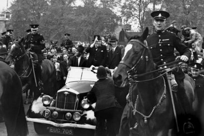 Churchill makes a victory sign on his way to the House of Commons, May 8, 1945