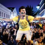 A Brazil football fan in a local market square