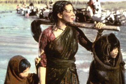 Nargis struggles to save her village from a flood in Mother India