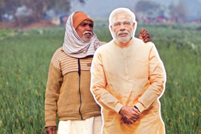 A farmer poses with a cutout of Prime Minister Narendra Modi in Dadri, Uttar Pradesh