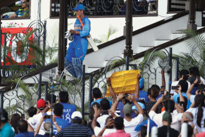 Fans greet Dhoni as he heads out to bat against Australia in India’s last ODI series before the World Cup