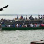 Boats ferry passengers on the Brahmaputra in Dhubri, Assam