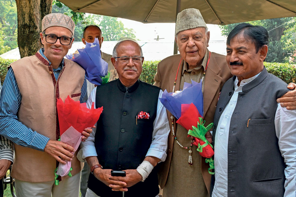 National Conference leaders Omar and Farooq Abdullah with J&K Congress chief Tariq Hameed