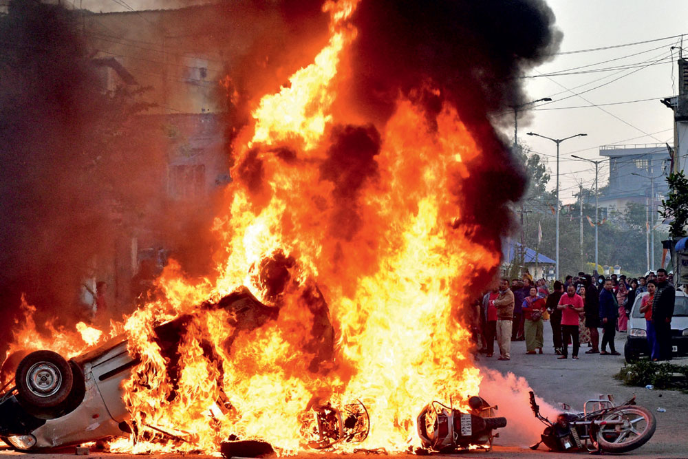 A vehicle set on fire by a mob in Imphal West, November 16, 2024