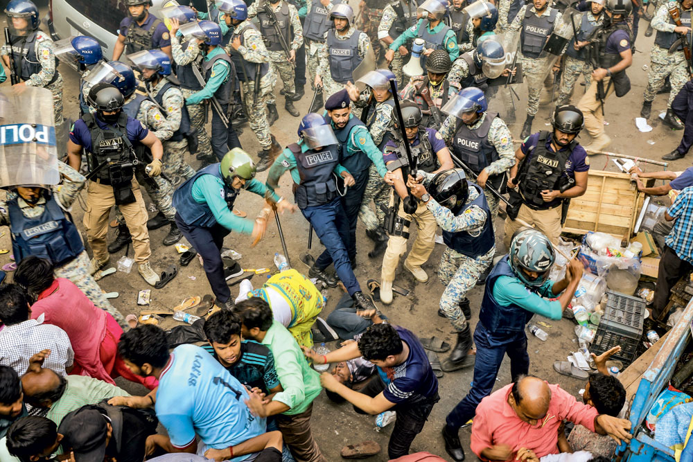 Police beat up supporters of Chinmoy Krishna Das, the Hindu monk charged with sedition, Chittagong, November 26, 2024