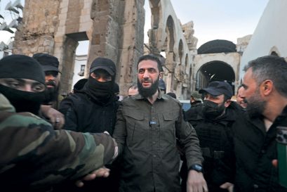 Hayat Tahrir-al Sham leader Abu Mohammed al-Jolani (centre) arrives at the Umayyad Mosque, Damascus, December 8, 2024