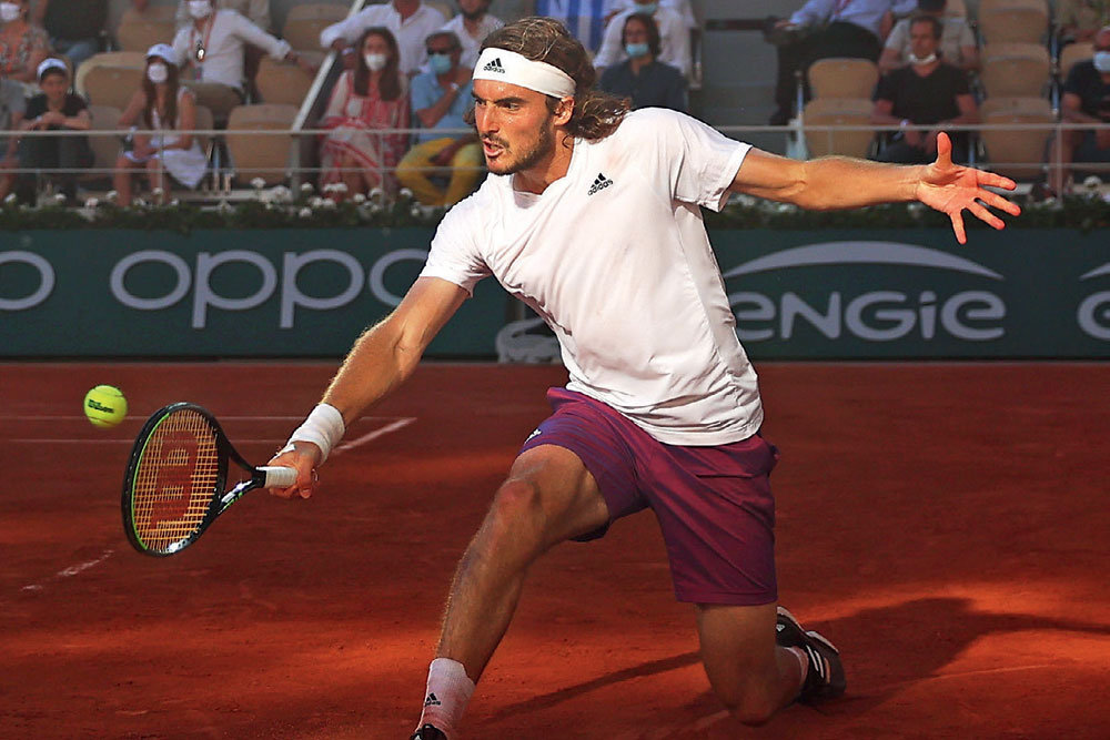 Stefanos Tsitsipas plays the backhand at the French Open final, June 13, 2021