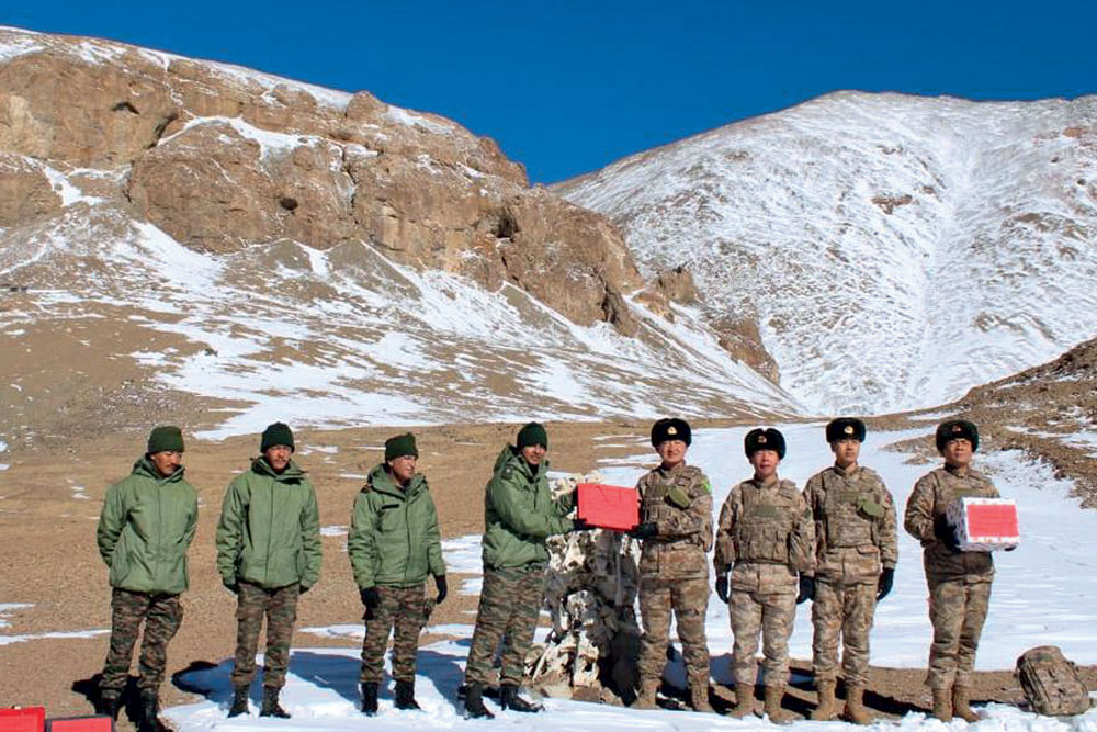 Indian and Chinese soldiers exchange sweets at Hot Springs in eastern Ladakh on Diwali, October 31, 2024