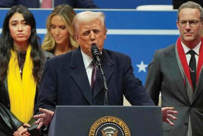 Released hostage Noa Argamani stands behind Donald Trump as he speaks at the Capitol One Arena, January 20, 2025