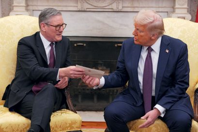 British Prime Minister Sir Keir Starmer hands US President Donald Trump an invitation from King Charles III for a state visit to the UK, Washington DC, February 27, 2025