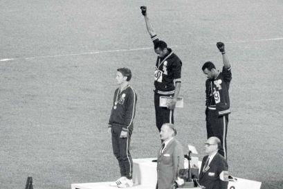 Tommie Smith (centre) and John Carlos (right) of the US at the Medal Ceremony of the Mexico City Olympics, 1968