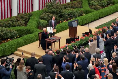 US President Donald Trump signs an executive order imposing tariffs on imported goods in the Rose Garden of the White House, April 2, 2025