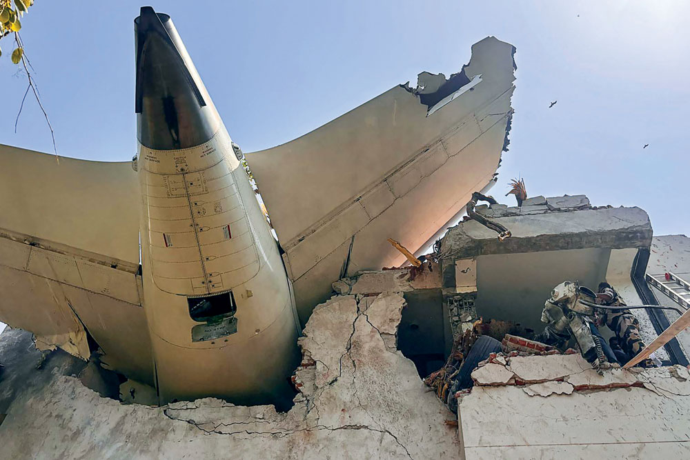 The tail of the aircraft sticking out of the BJ Medical College building